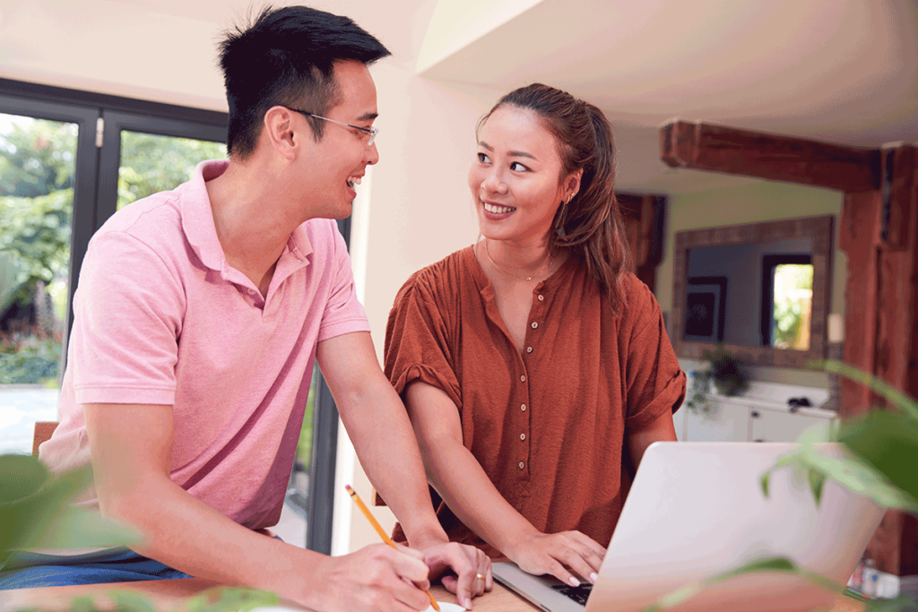 Couple discussing the benefits of taking out a personal loan.