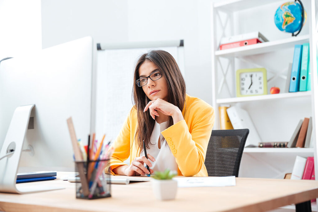 Businesswoman staring into her computer screen