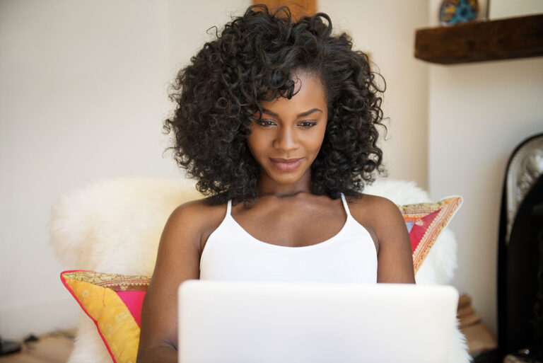 Young woman applying for a personal loan on her laptop.