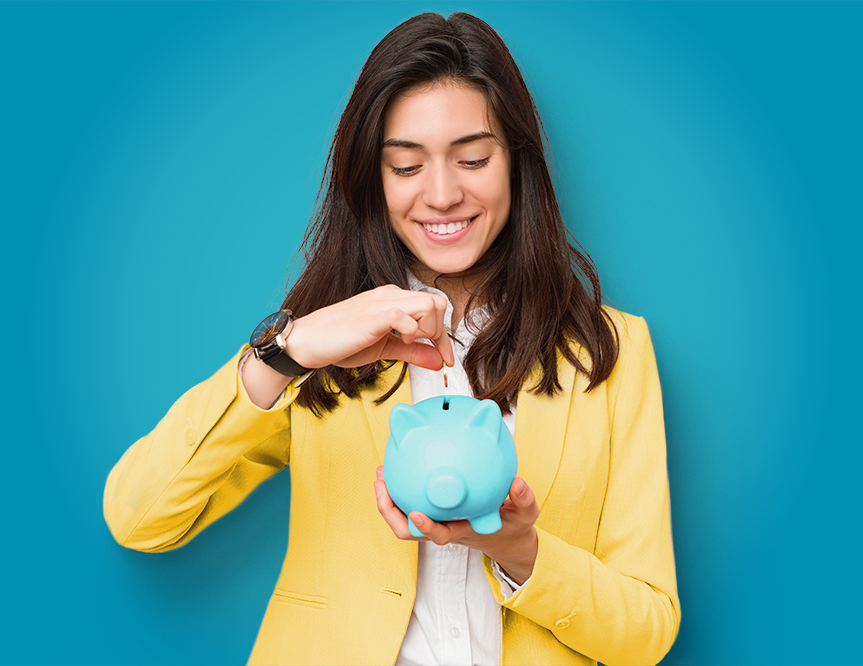 Young woman placing coins in her piggy bank.