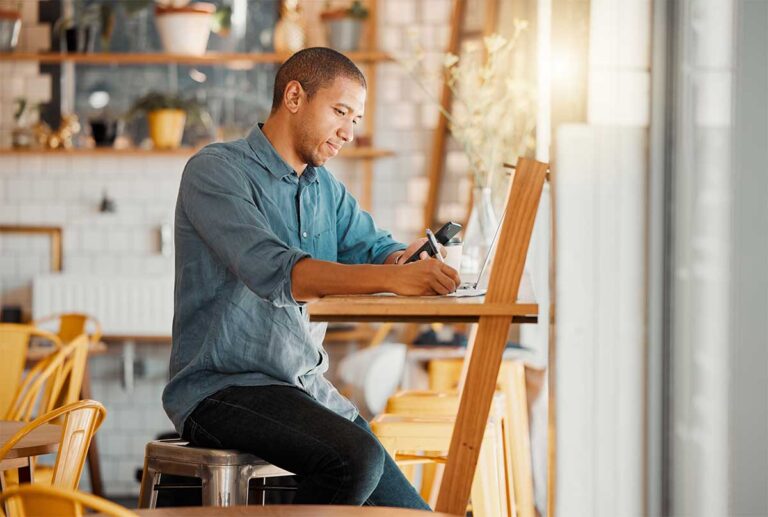 man sitting setting short term financial goals for new year